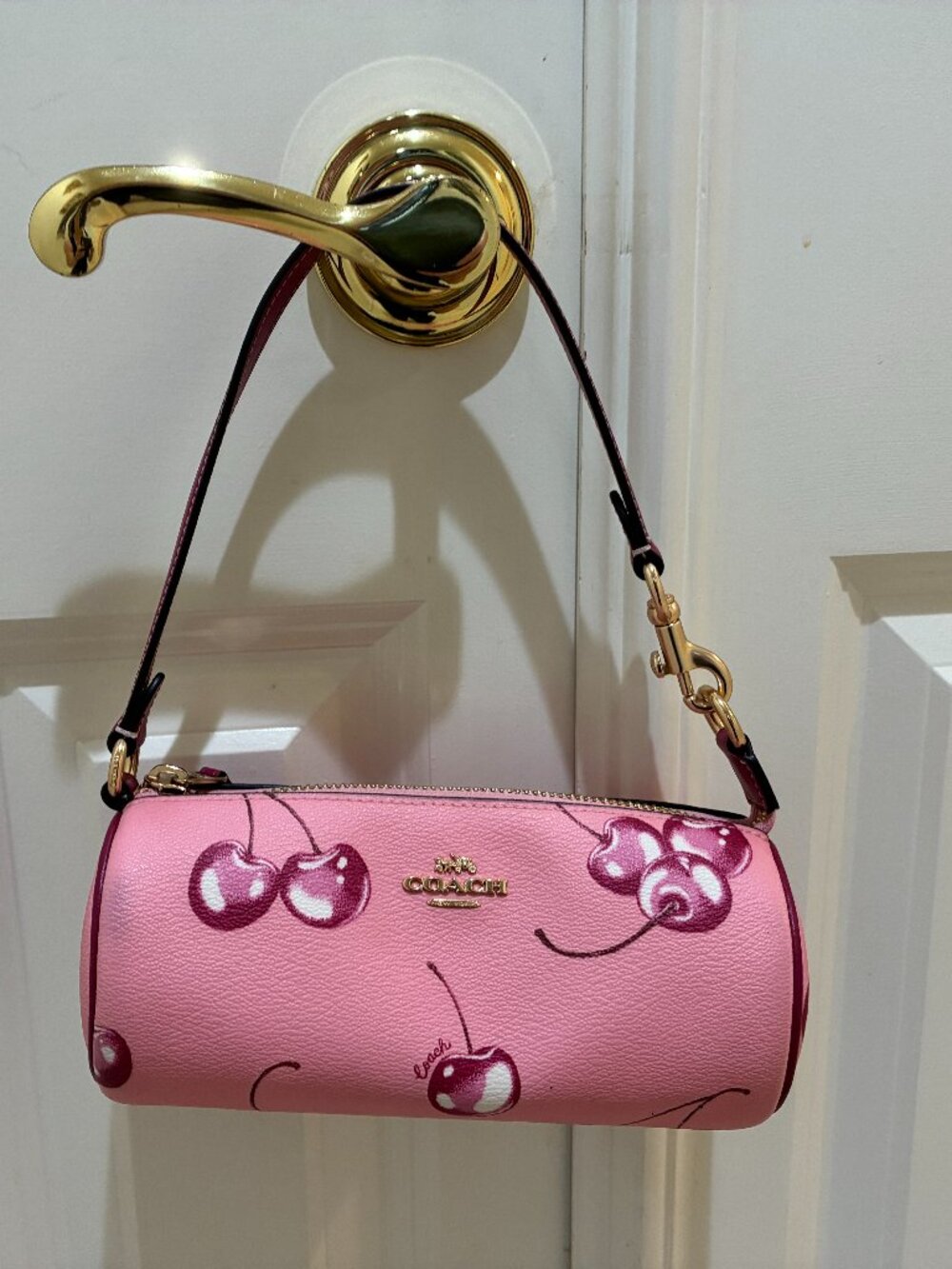 Coach Nolita cherry-printed barrel bag